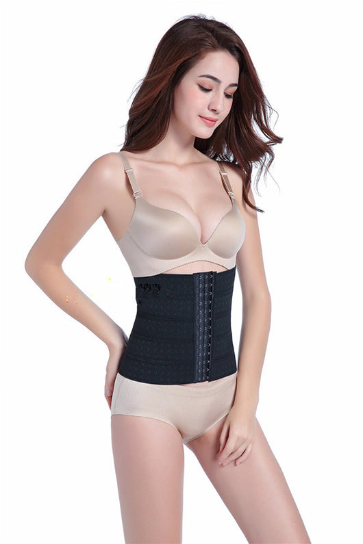 Woman modeling a beige waist trainer with hook-and-eye closures and a subtle floral pattern.