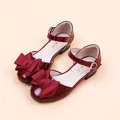 Dark red patent leather Mary Jane shoes for big kids, featuring a large grosgrain bow on the toe and a block heel. - Image 10