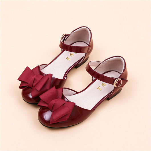 Dark red patent leather Mary Jane shoes for big kids, featuring a large grosgrain bow on the toe and a block heel. - Image 10