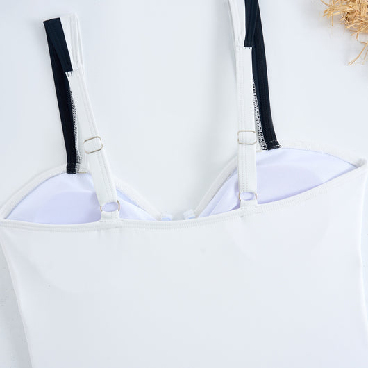 White one-piece women's swimsuit with black side panels and straps, featuring a ruched bust and U-shaped detail. - Image 17