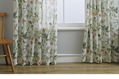 Dark gray semi-sheer curtains with a white and green floral pattern, hung on a black rod in a living room. - Image 15