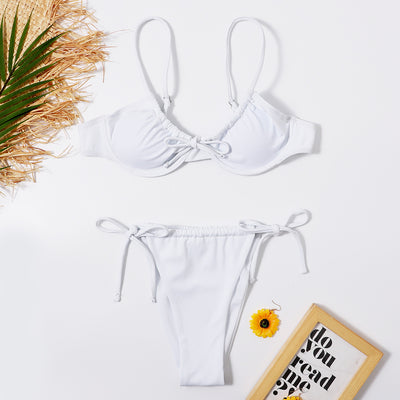 White two-piece underwire swimsuit with a front tie bikini top and adjustable string bottoms, displayed flat. - Image 8