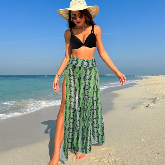 Women's pink, black, and white abstract striped bikini with a push-up top and strappy high-cut bottoms on a beach. - Image 21