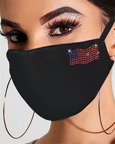 Black cotton face mask with a rhinestone flower design and "Be Kind" in pink rhinestones, worn by a person. - Image 10