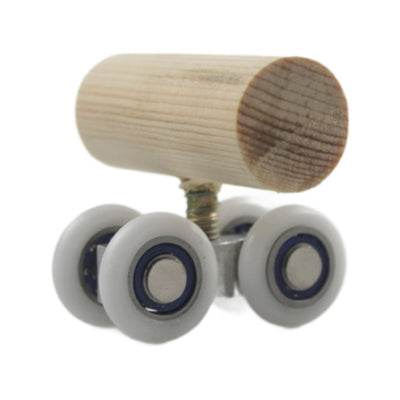 Wooden bird toy resembling a roller skate with a pine log body and four white wheels with metal bearings. - Image 5