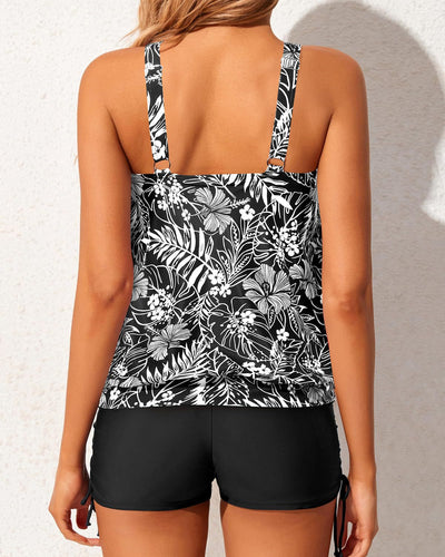Women's two-piece tankini swimsuit with a colorful abstract print tank top and solid black ruched swim shorts. - Image 31