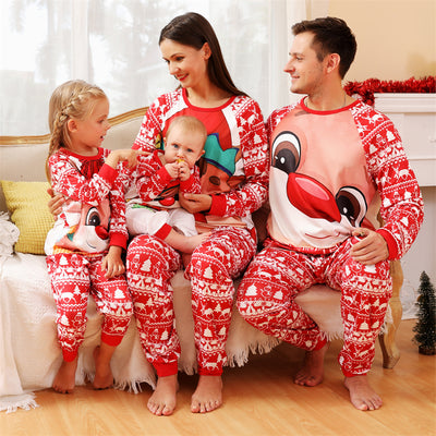 Baby wearing a red and white Christmas pajama set with a fawn graphic, sitting on a white blanket. - Image 16