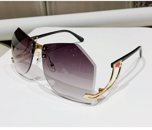 Rimless sunglasses with gradient pink lenses and gold-tone hollow temples, featuring a unique quadrilateral shape. - Image 16