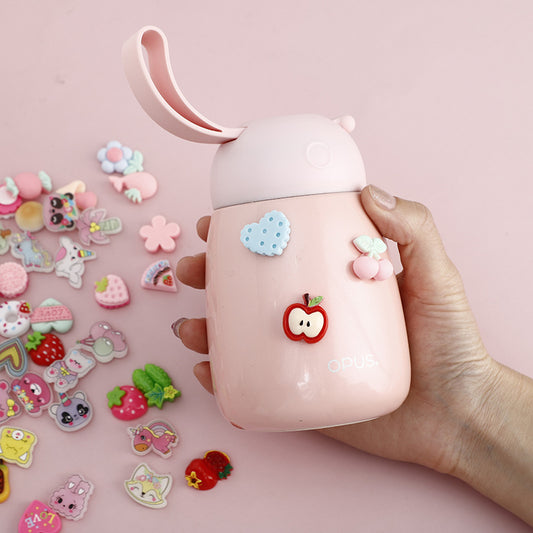 Pack of colorful cartoon plastic stickers featuring cherries, strawberries, flowers, cookies, and rainbows, in a clear bag with a "bunny flower story" header.