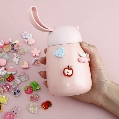 Pack of colorful cartoon plastic stickers featuring cherries, strawberries, flowers, cookies, and rainbows, in a clear bag with a "bunny flower story" header.