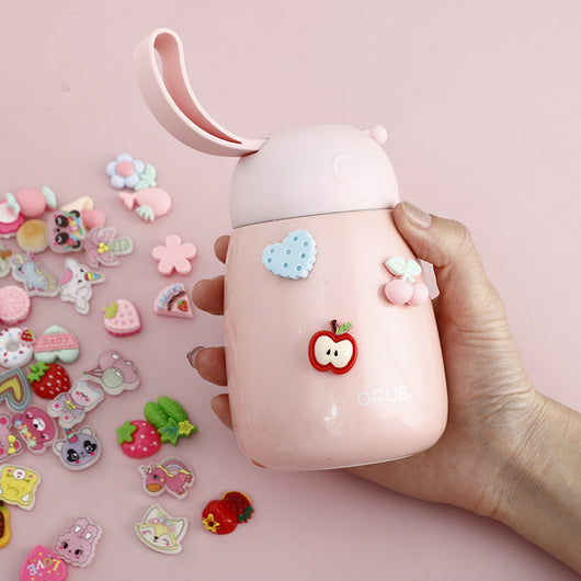 Pack of colorful cartoon plastic stickers featuring cherries, strawberries, flowers, cookies, and rainbows, in a clear bag with a "bunny flower story" header.