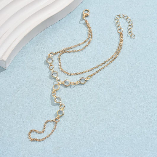 Gold-tone layered bracelet ring with clear crystal accents and a finger loop, featuring a lobster clasp closure. - Image 8
