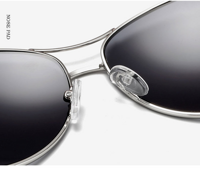 Women's large frame fashionable sunglasses with gradient gray lenses, silver-tone metal frames, and white arms. - Image 23