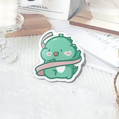 Cute green cartoon dinosaur acrylic badge brooch with a shy expression and small spikes on its back. - Image 12