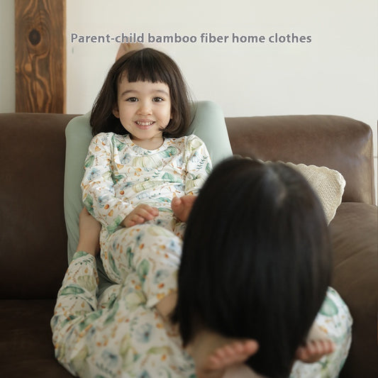 Bamboo cotton knitted parent-child pajama set with a pumpkin print long-sleeve top and solid light blue-grey pants. - Image 2