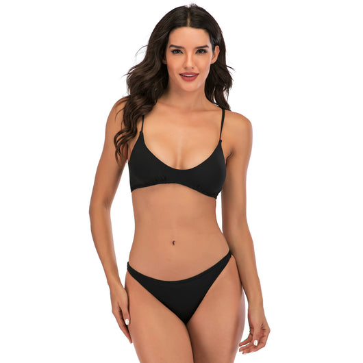 Woman wearing a colorful abstract floral print two-piece bikini with a low-waist bottom and triangle top. - Image 8