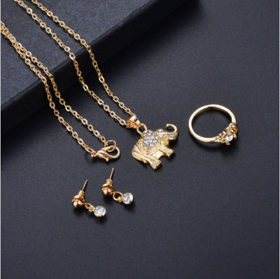 Rose gold-toned jewelry set with an elephant pendant necklace, matching rhinestone drop earrings, and a heart-knot ring. - Image 7