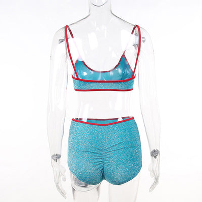 Shimmery purple two-piece swimsuit with orange trim, featuring a bralette top and high-waisted shorts. - Image 13