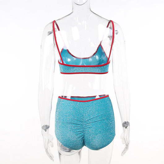 Shimmery purple two-piece swimsuit with orange trim, featuring a bralette top and high-waisted shorts. - Image 13