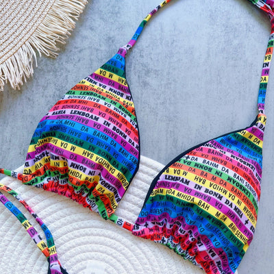 Women's multicolor letter printed lace-up bikini suit with triangle top and thong bottom, displayed on a white mat. - Image 14