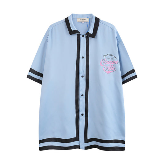 Playera de Manga Corta con Bloques de Color e Impresión de Letras