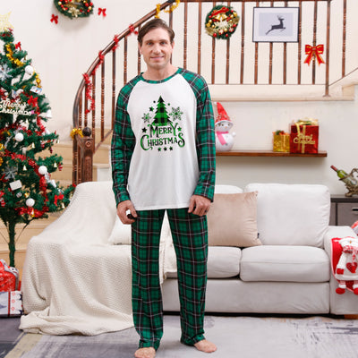 Family of four wearing matching green plaid Christmas pajamas with "Merry Christmas" and Christmas tree print. - Image 17