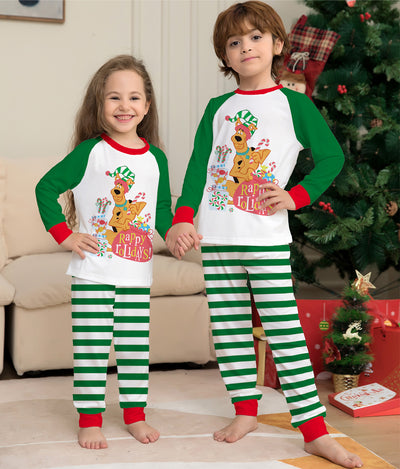 Woman wearing green and white striped holiday pajamas with a Scooby-Doo "Happy Holidays!" graphic on the top. - Image 6