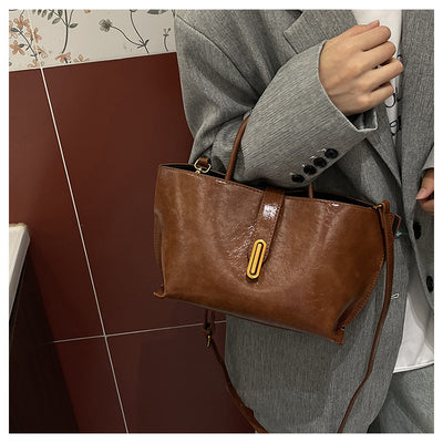 Bolso Bucket de Cuero Encerado Elegante y Portátil - Image 16