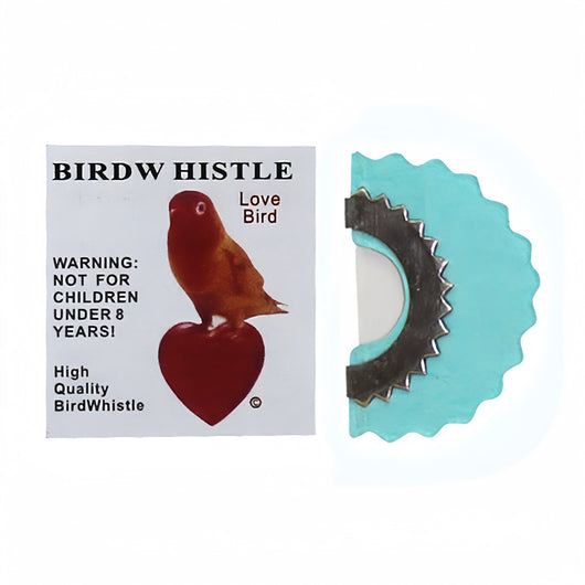 Red bird whistle with a serrated metal edge, next to a white label featuring a bird on a heart and a warning. - Image 2