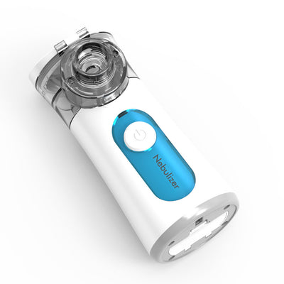 White and blue handheld ultrasonic nebulizer with a clear mask, emitting a blue light, against a bright blue sky. - Image 5