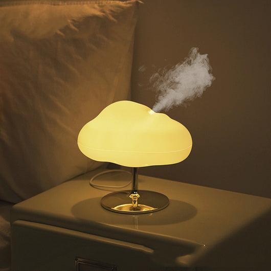 White cloud-shaped aroma diffuser and humidifier with a silver chrome stand on a white background.