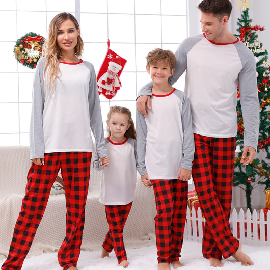 Family of four wearing matching red and black buffalo plaid Christmas pajamas with white and grey raglan tops. - Image 5