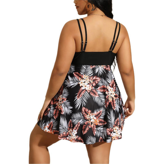 Plus size women's navy blue swimsuit with a V-neck, ruched bust, and tropical floral print skirt bottom. - Image 5