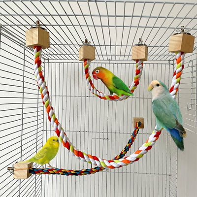Colorful braided rope bird toy with wooden blocks and metal fasteners, forming a circular swing or climbing perch.