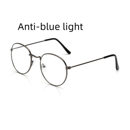 Retro oval anti-blue light glasses with a dark metal frame and clear lenses on a white background. - Image 10