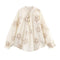 Blusa Elegante con Bordados Florales y Cuello en V