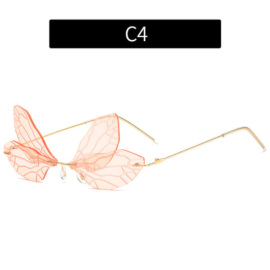 Light green rimless butterfly sunglasses with gold metal frames, featuring a unique veined lens design. - Image 8