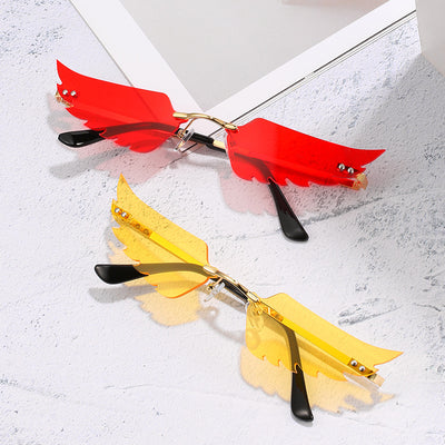 Red angel wings sunglasses with gold metal arms and black earpieces, featuring a unique rimless design. - Image 16