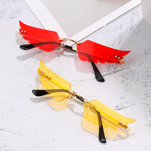 Red angel wings sunglasses with gold metal arms and black earpieces, featuring a unique rimless design. - Image 16