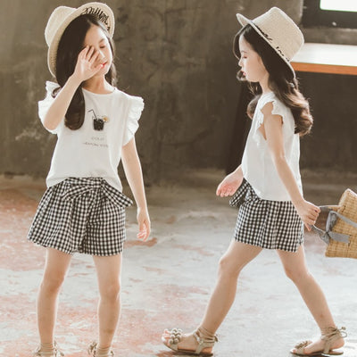 Conjunto Infantil Niña Estilo Coreano: Blusa Manga Corta y Short a Cuadros con Moño - Image 4