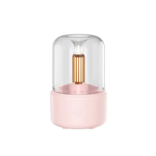 White cylindrical aroma diffuser with a clear top and an amber candlelight-effect LED light. - Image 8