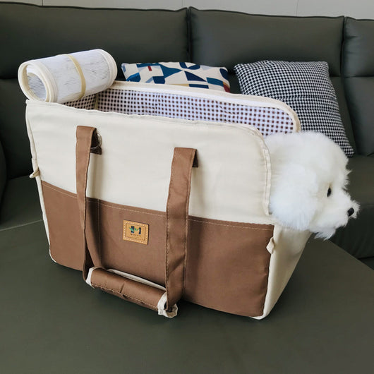 Two-tone beige and brown canvas pet carrier bag with mesh top and a small white dog peeking out. - Image 2