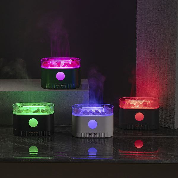 Black desktop humidifier with clear top filled with pink Himalayan salt rocks and rose gold control buttons.