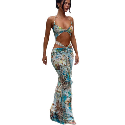 Women's two-piece swimsuit with a halter bikini top and a matching long skirt, featuring a vibrant tropical and animal print. - Image 5