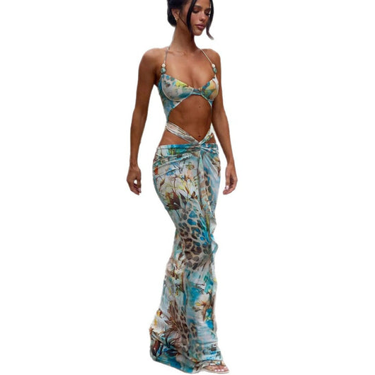 Women's two-piece swimsuit with a halter bikini top and a matching long skirt, featuring a vibrant tropical and animal print. - Image 5
