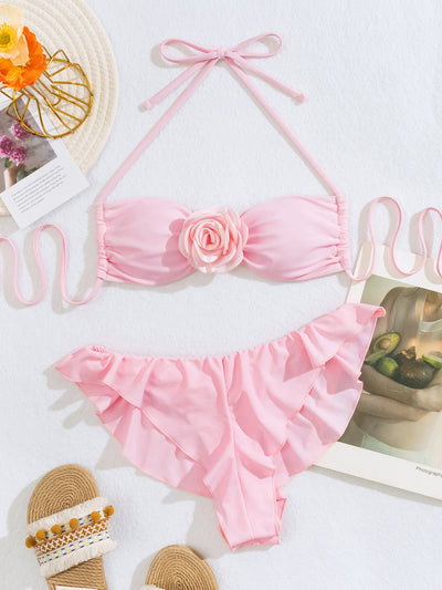 Women's pink halter bikini with a 3D flower on the top and ruffled edges on the bikini bottom. - Image 3