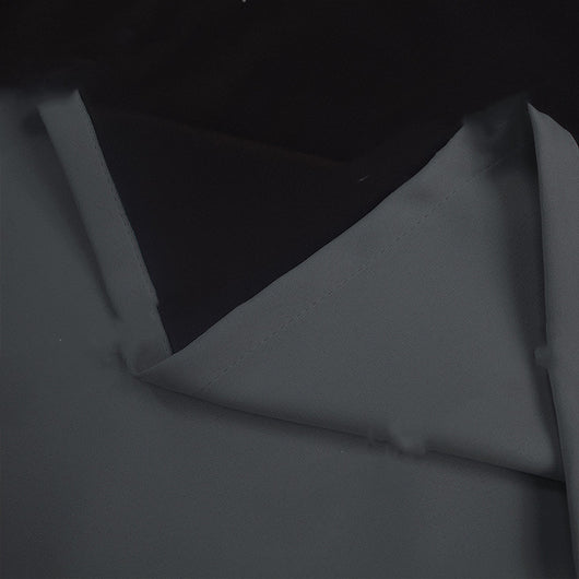 Close-up of a navy blue blackout curtain, showcasing the fabric texture and the black lining on the back. - Image 5