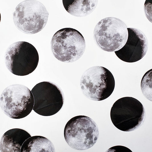Circular black and white stickers depicting various moon phases, with a small black sticker box on a white background.