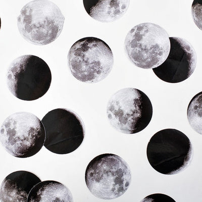 Circular black and white stickers depicting various moon phases, with a small black sticker box on a white background.