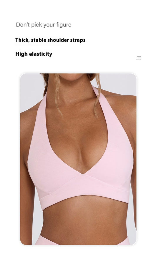 Light pink halter neck sports bra and high-waisted leggings workout set on a model. - Image 35